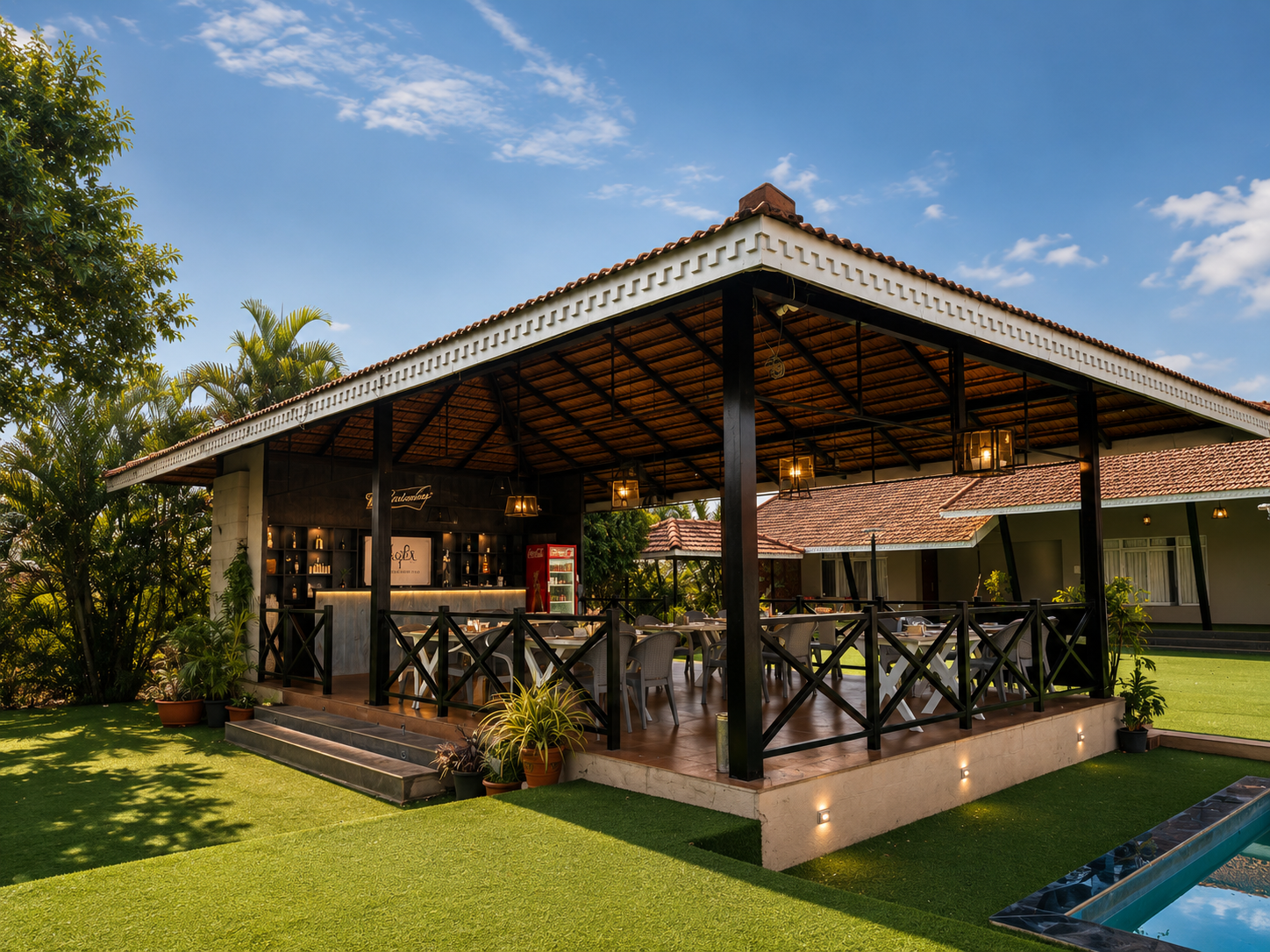 Daytime view of property, pool and dining